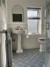 Victorian style bathroom with grey patterned vinyl floor